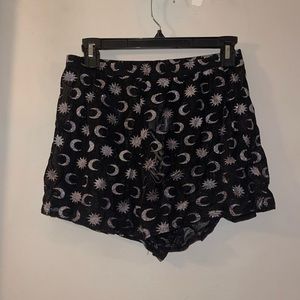 Sheer black shorts with stars and moons
